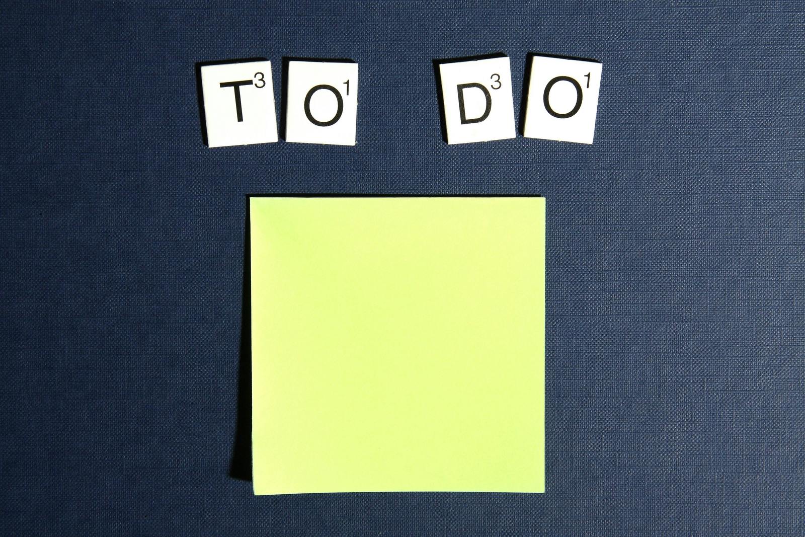 to do list made of letter tiles and a sticky note