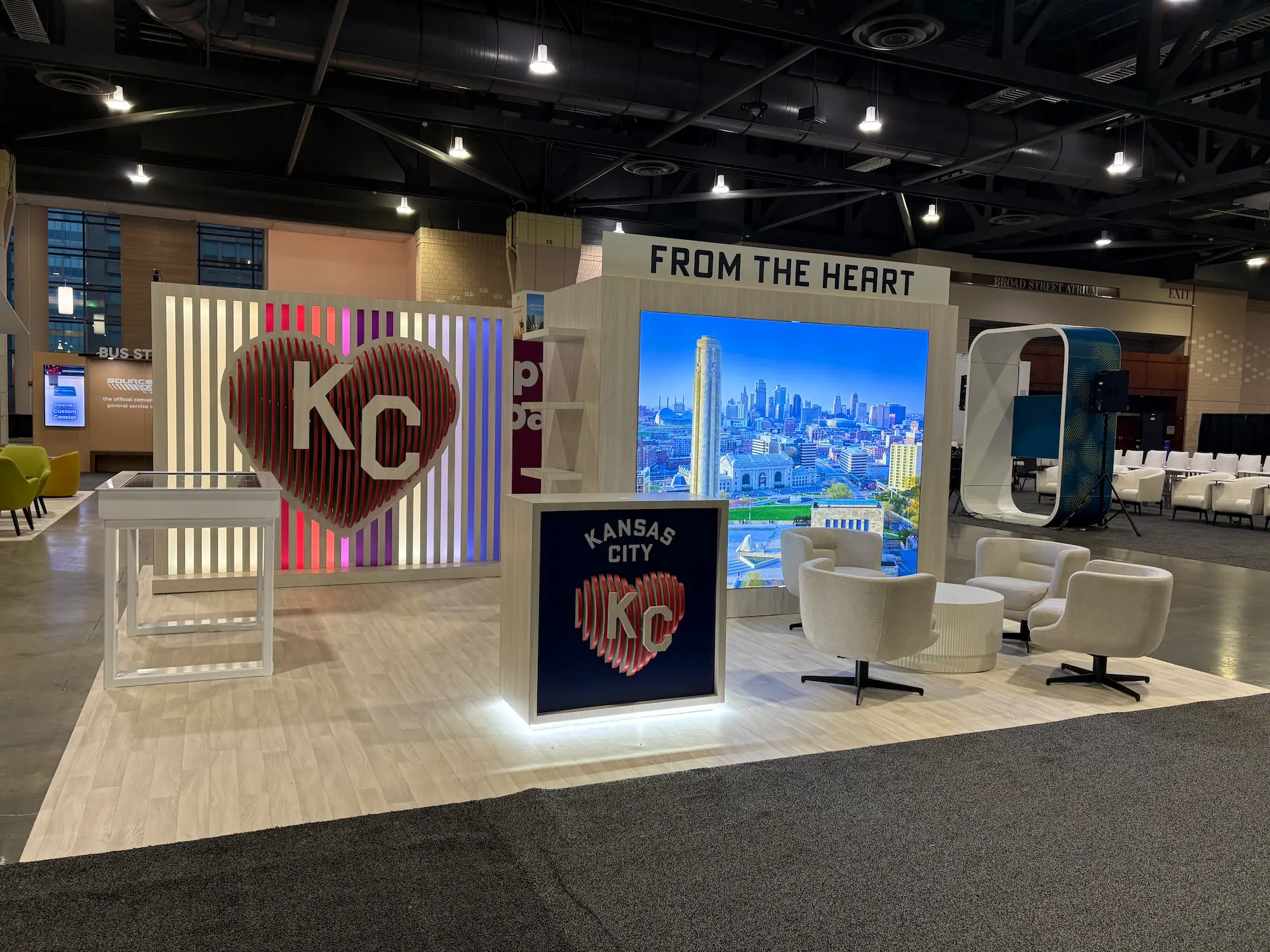 Custom trade show booth for Visit KC featuring durable aluminum framing, modular wall panels, LED lighting, and fabric graphics at PCMA 2026