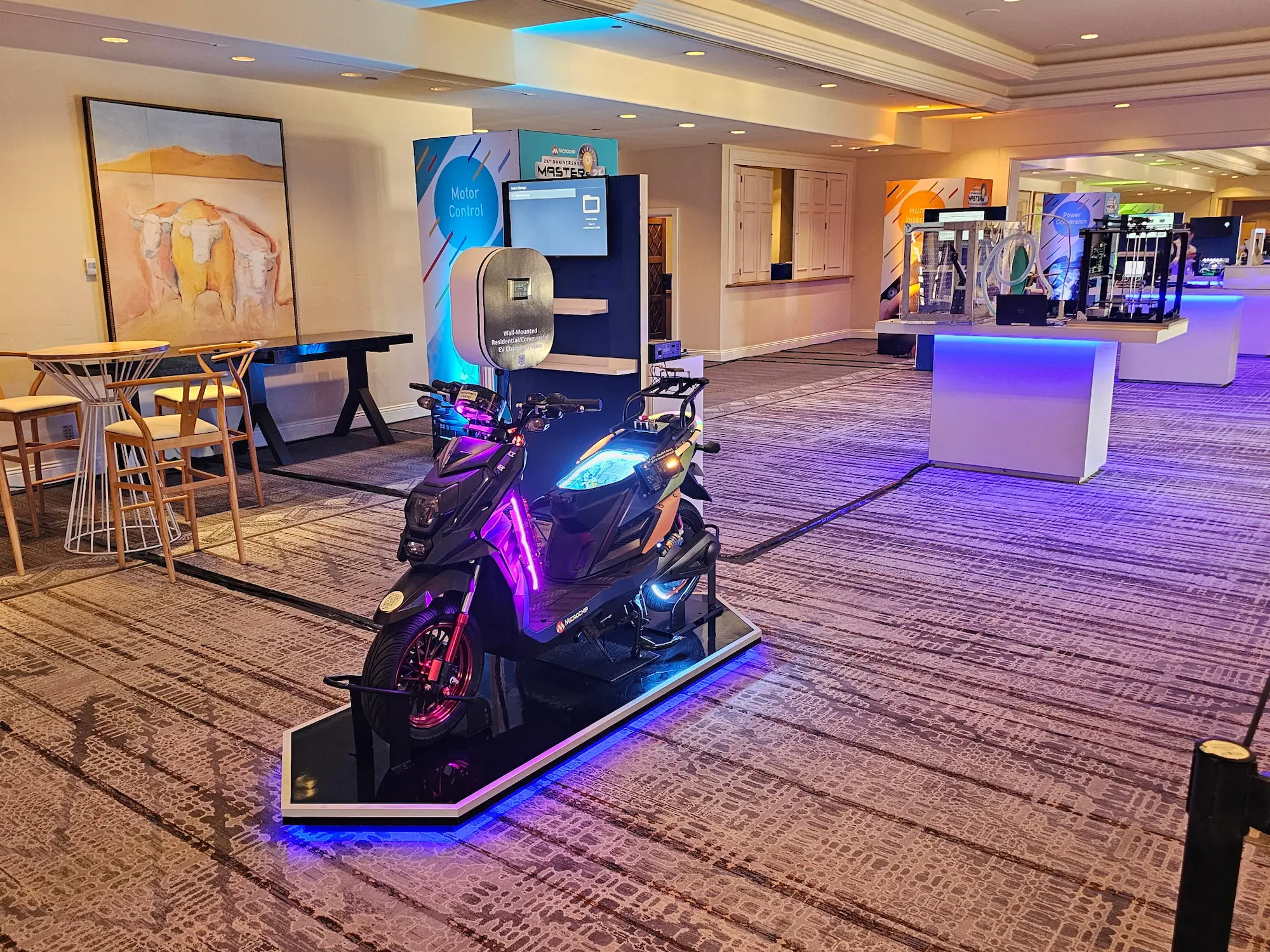 Microchip Masters corporate event photography showcasing branded product display stations and LED lit electric scooter exhibit produced by Highway 85 Productions