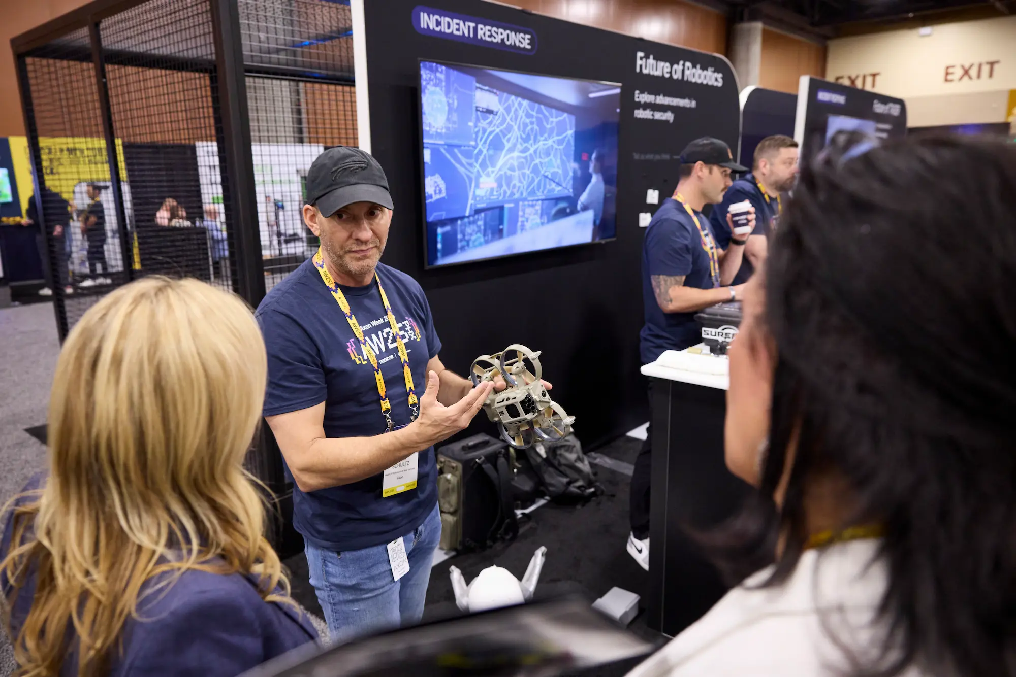 Axon Week 2025 product demo station with branded display screens and incident response signage produced by Highway 85 Productions