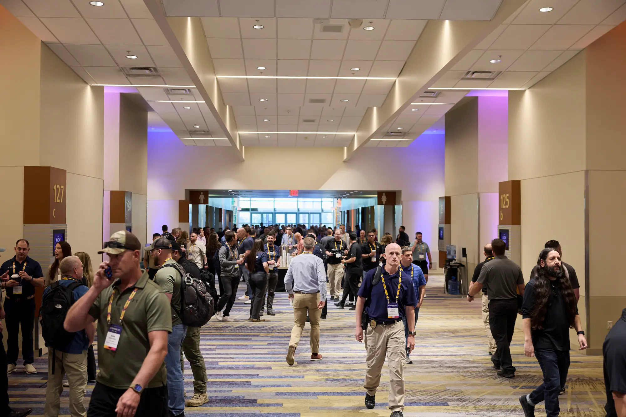 Attendees moving through a busy hallway between sessions at Axon Week 2025 corporate event produced by Highway 85 Productions
