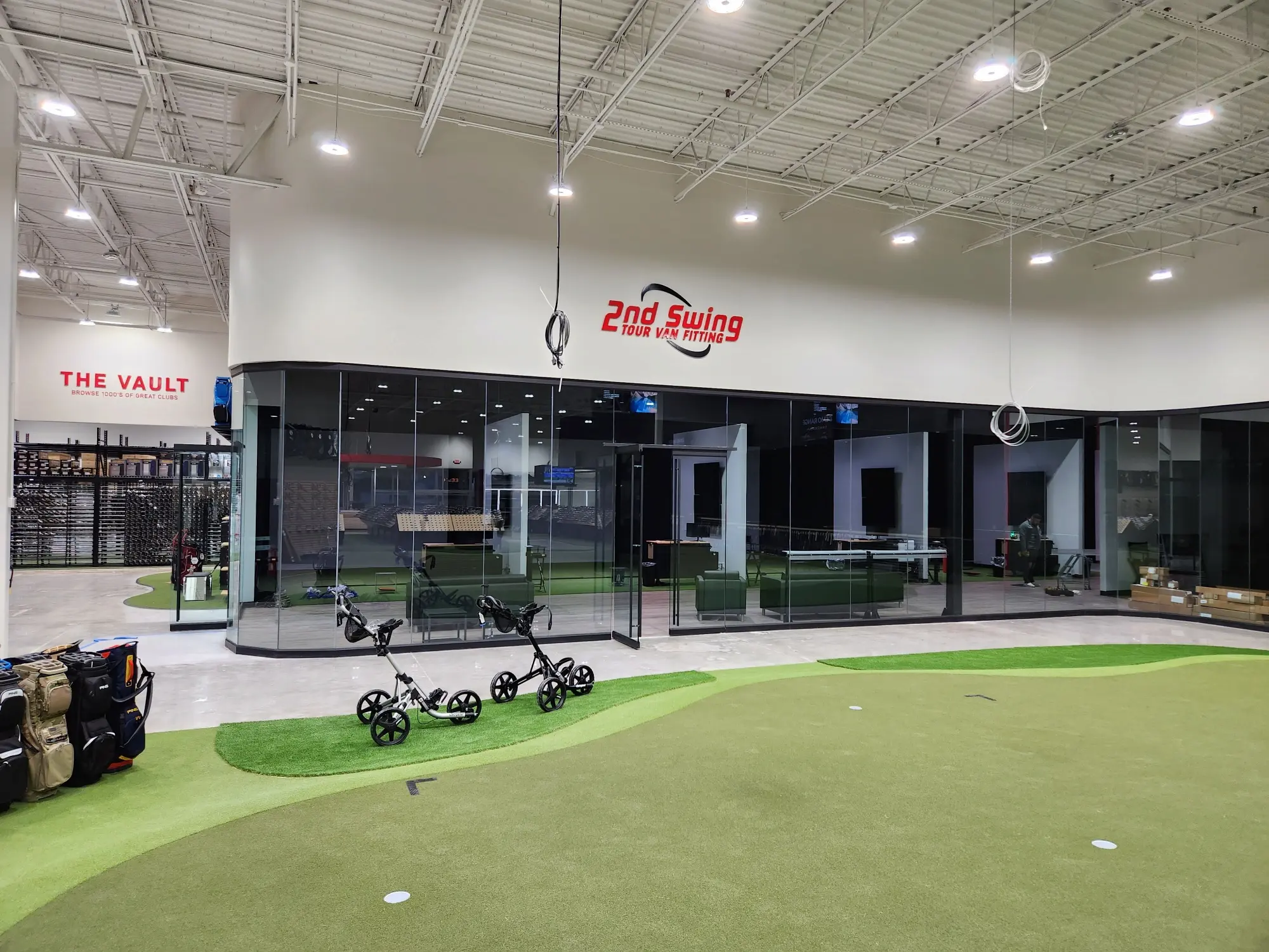 2nd Swing Golf retail interior commercial fabrication project featuring custom fitting bays, branded wall graphics, and permanent interior installations by Highway 85 Productions
