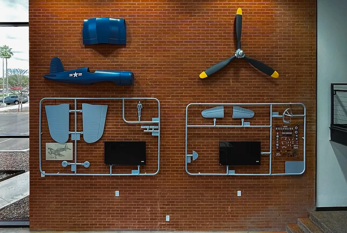 Abel Aviation museum exhibit fabrication with custom dimensional aircraft wall installation and permanent interior display by Highway 85 Productions