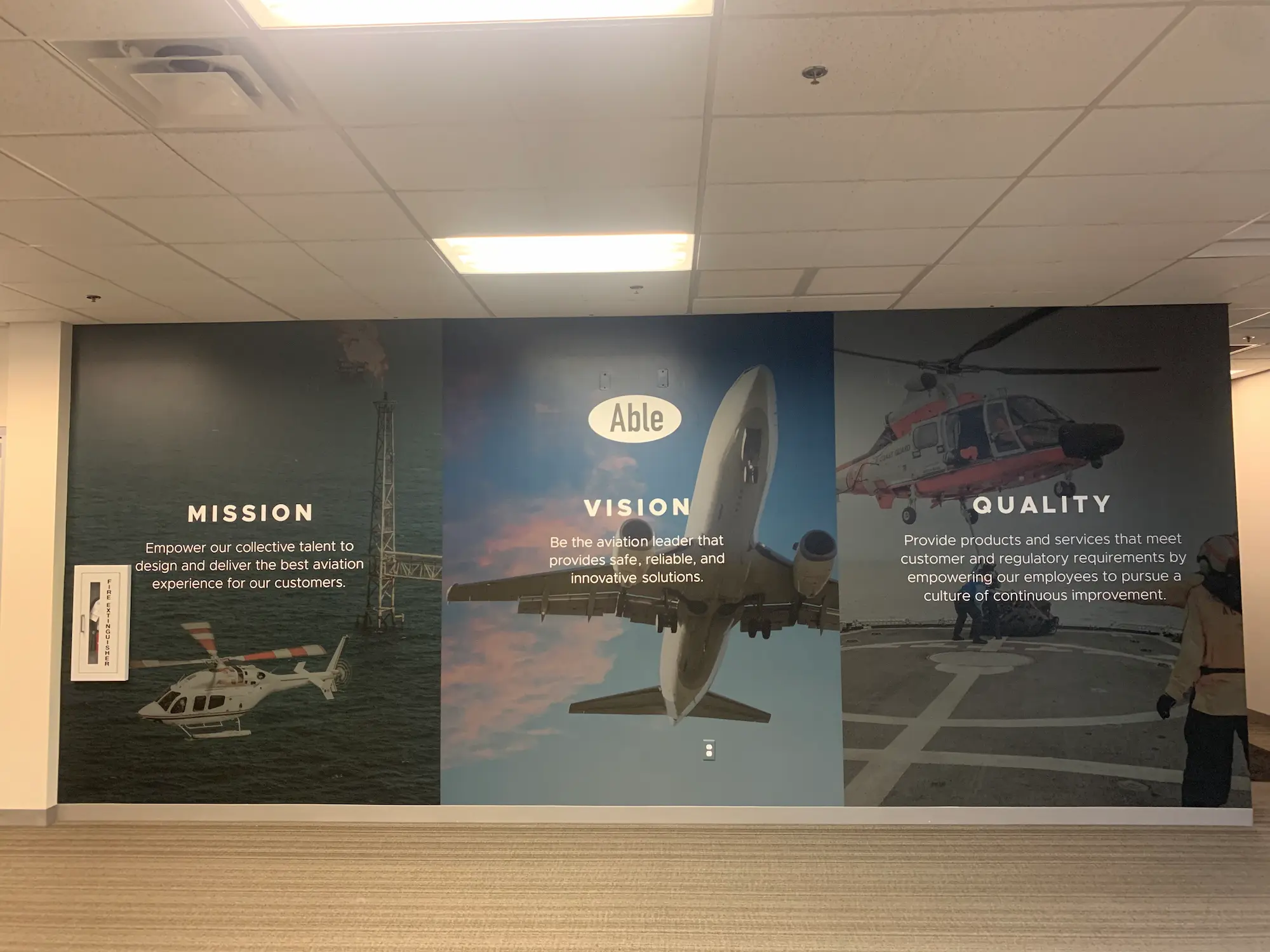 Able Aviation culture wall design with large format mission vision and quality branded graphics and permanent interior installation by Highway 85 Productions