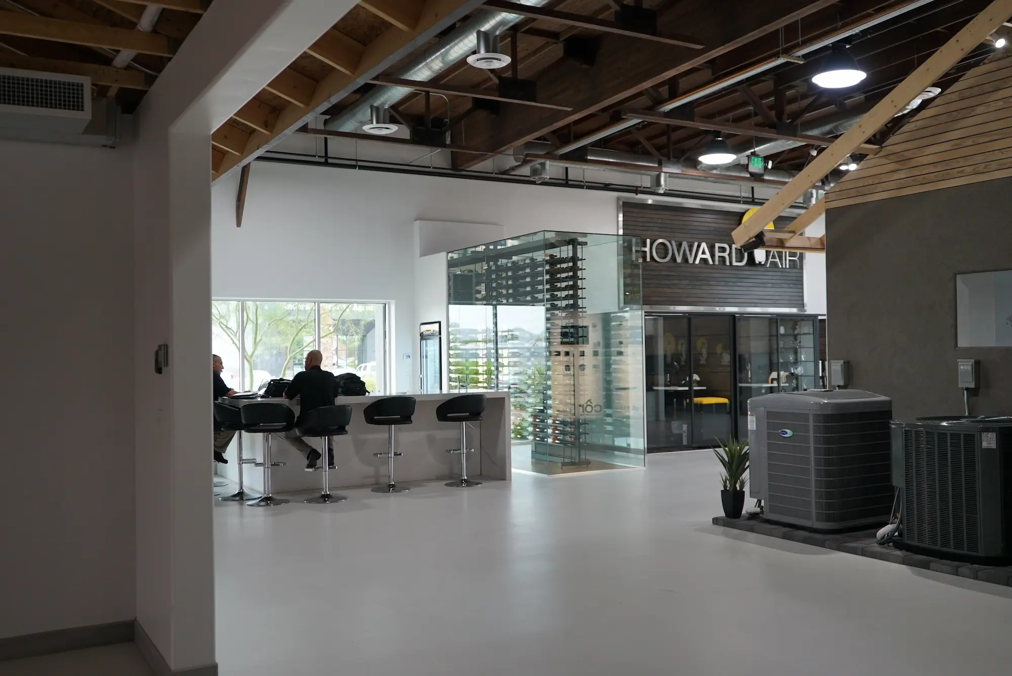 Howard Air retail interior branding project with custom fabricated reception area, branded signage, and permanent commercial installation by Highway 85 Productions