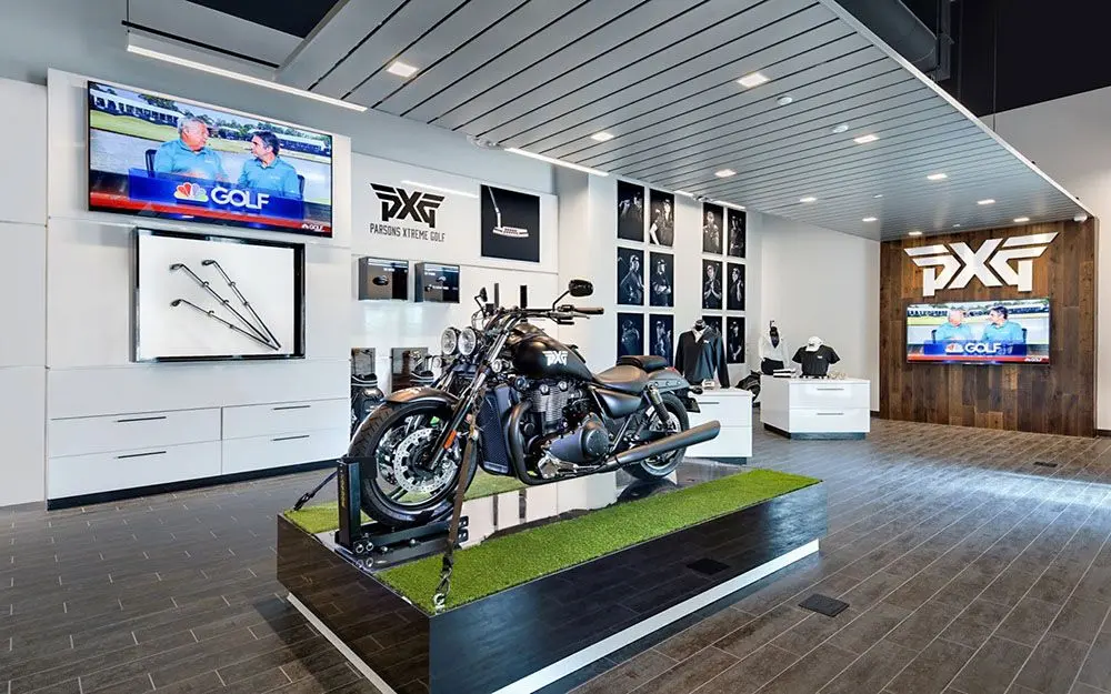 PXG Parsons Xtreme Golf retail interior with employee experience design featuring custom branded display wall, dimensional signage, and permanent commercial installation by Highway 85 Productions