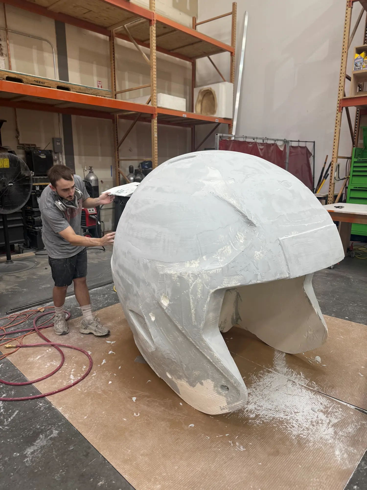 Highway 85 Productions fabrication team building a large scale custom foam helmet prop in the shop for an agency client activation project