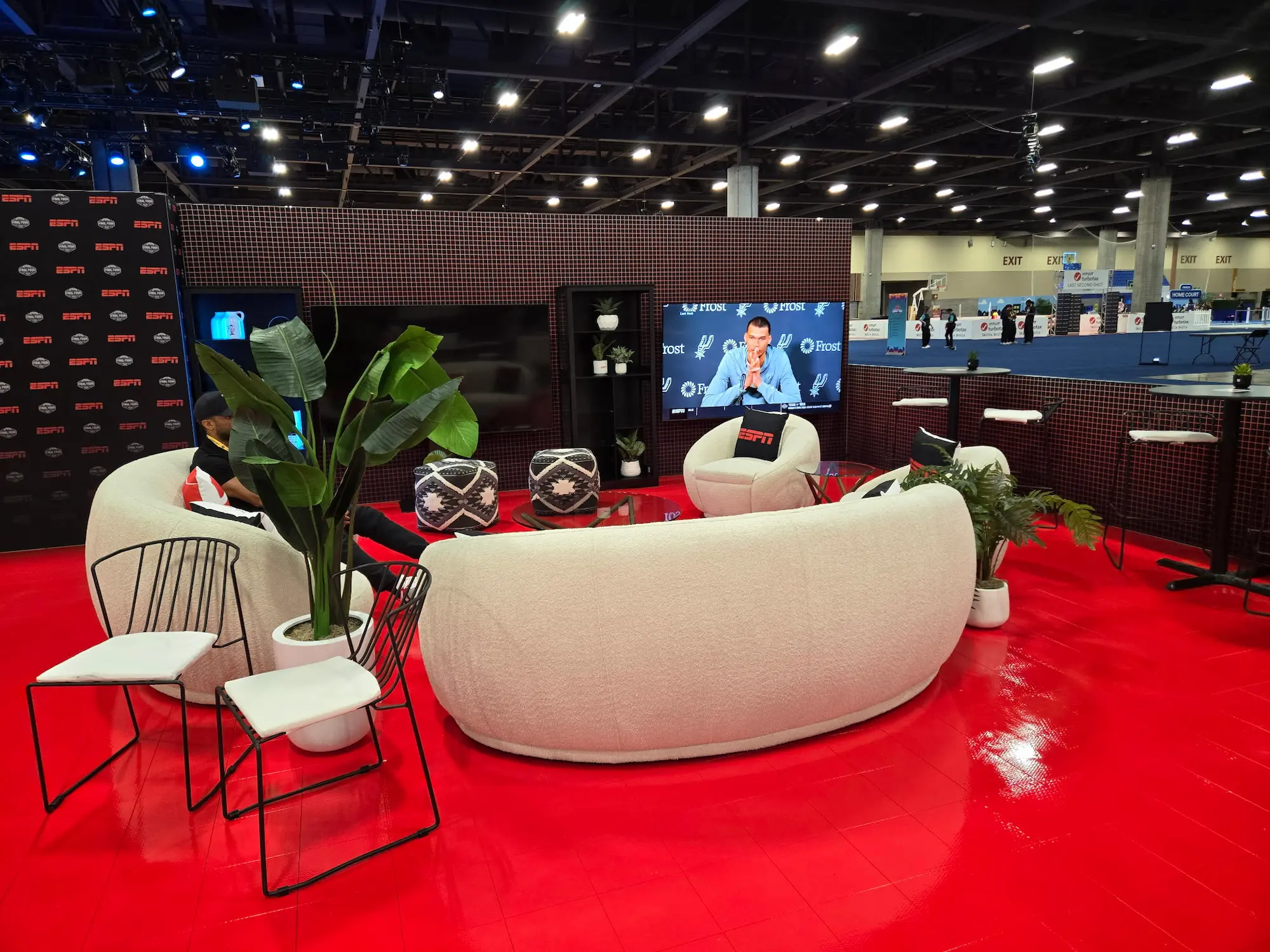 ESPN 50x50 custom trade show lounge environment with branded flooring and fabricated display wall demonstrating regional fabrication capability by Highway 85 Productions