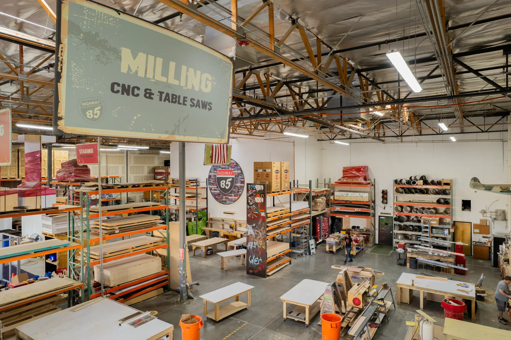 Highway 85 Productions custom trade show booth fabricator shop floor showing CNC milling, staging area, and material storage for exhibit fabrication