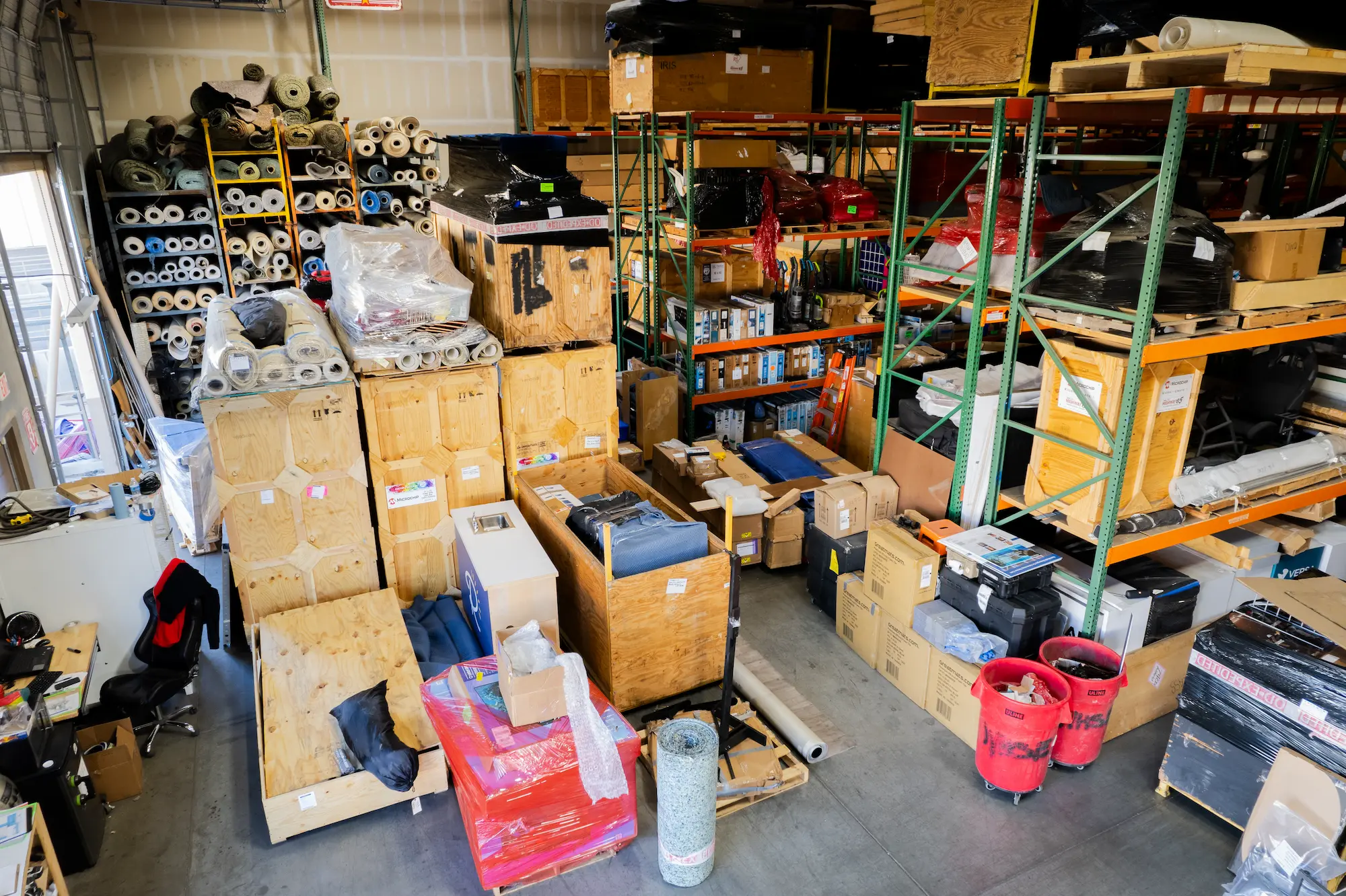 Highway 85 Productions warehouse with custom trade show booth storage crates, graphics rolls, and exhibit components organized between shows