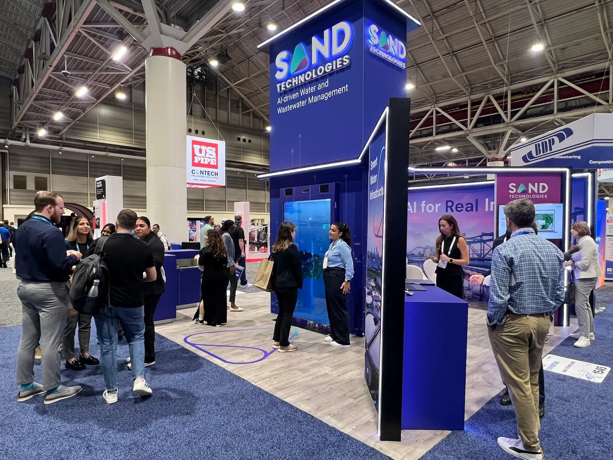 Sand Tech 20x20 custom trade show booth project with branded structure, integrated lighting, and clean fabrication showing what a well-executed exhibit looks like by Highway 85 Productions
