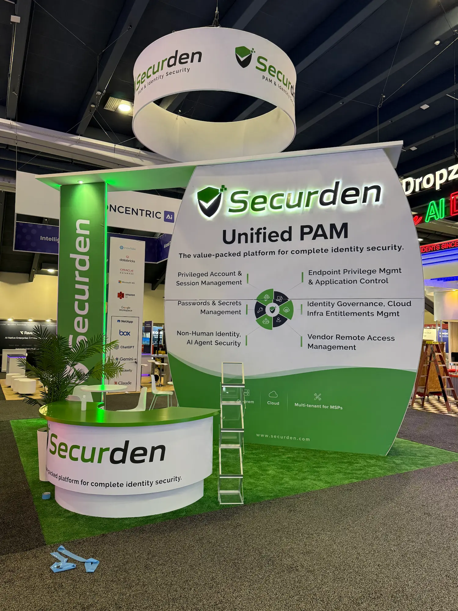 SecureDen 20x20 custom trade show booth showing the difference between custom vs modular trade show booth design by Highway 85 Productions