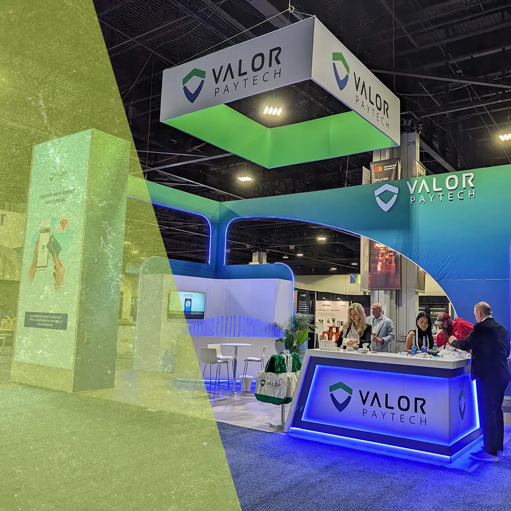 island trade show booth featuring custom archways, branded handing signs, branded tower structures and custom counters