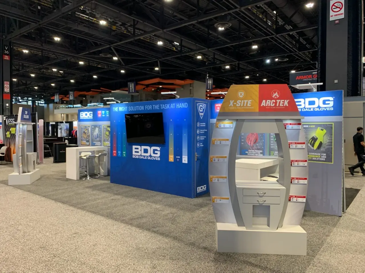 BDG custom 10x20 trade show booth design with open layout, branded backwall, and clean counter showing effective small booth design by Highway 85 Productions