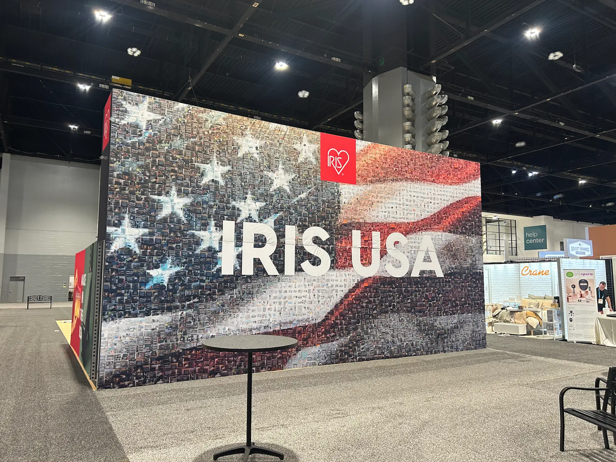 IRIS 30x50 custom trade show booth with large format graphics, bold branded backwall, and dimensional signage showing professional trade show booth graphics by Highway 85 Productions