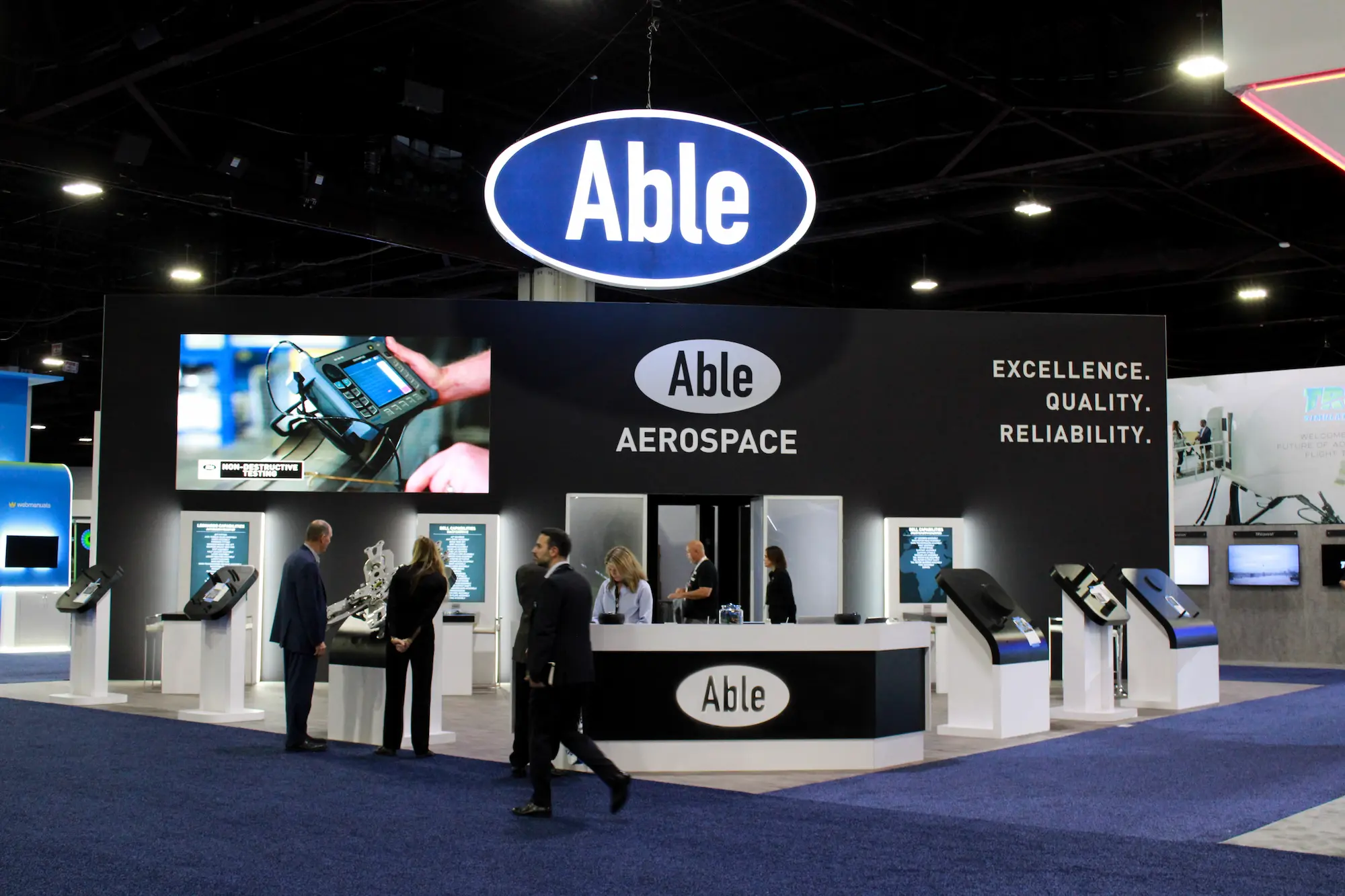 Able custom 20x30 trade show booth with branded backwall and clean sightlines designed for trade show booth photography by Highway 85 Productions