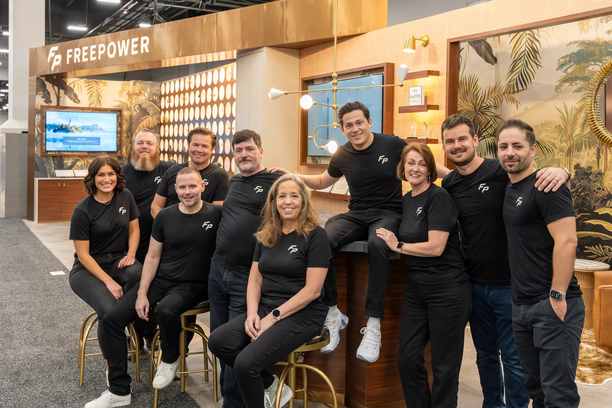 FreePower trade show booth team photo showing the kind of results that help justify a trade show budget investment to leadership by Highway 85 Productions