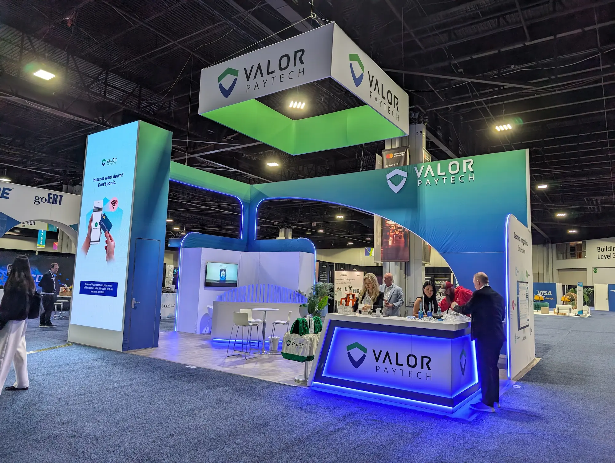 Valor Paytech custom 20x30 trade show booth showing what a well-planned trade show budget delivers on the show floor by Highway 85 Productions