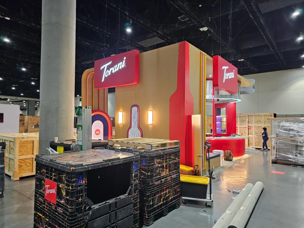Torani 20x30 custom trade show booth on the show floor showing the fabrication and logistics investment behind hidden trade show costs by Highway 85 Productions